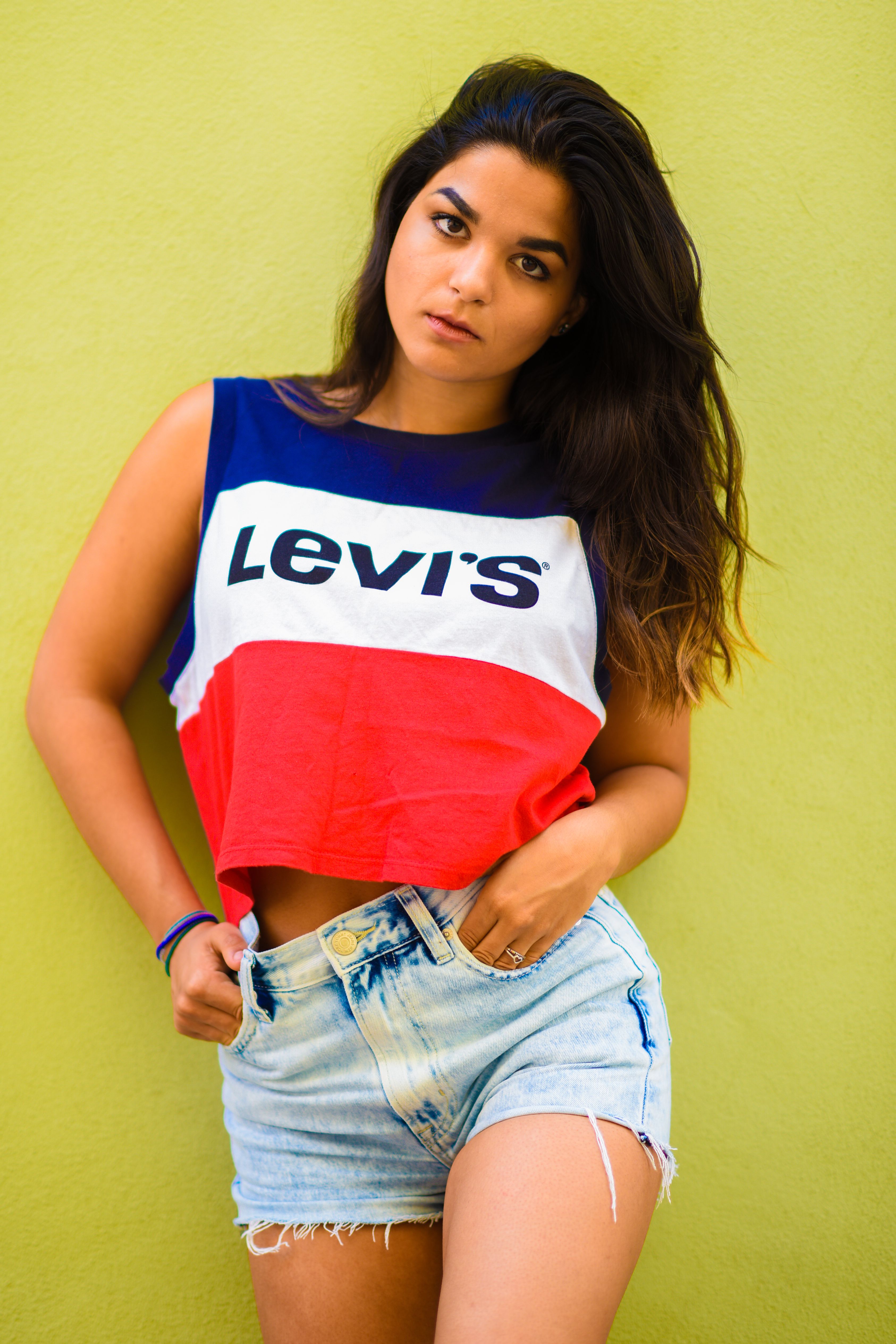 woman in vintage graphic tee and denim shorts