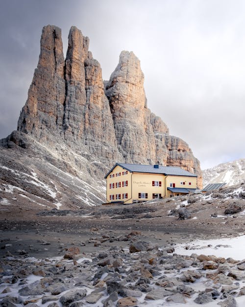 Yellow and Brown Concrete House Near Rocky Mountain