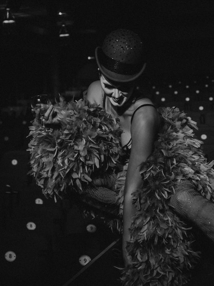 Woman In Costume And Feathers On Stage