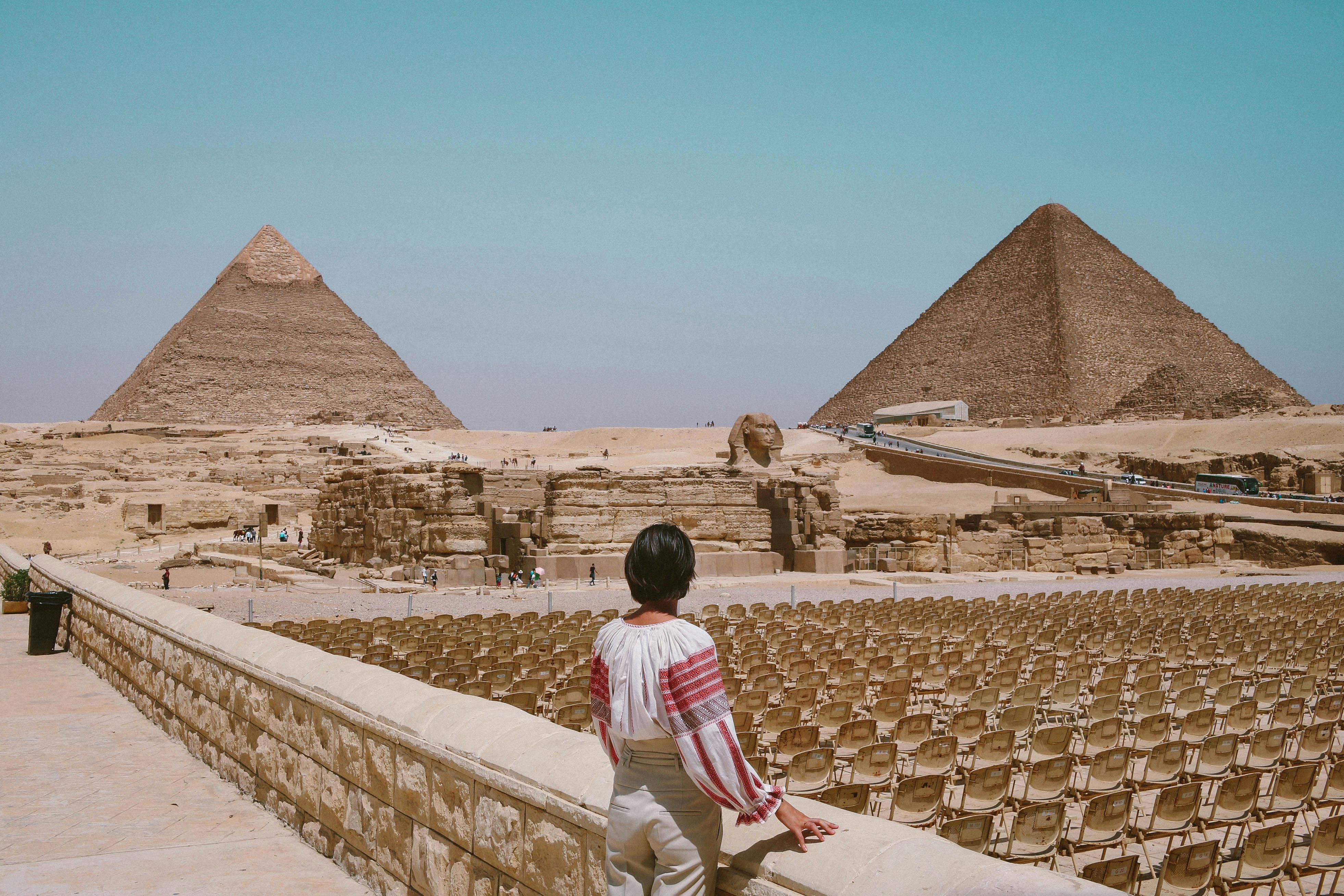 woman looking at pyramids