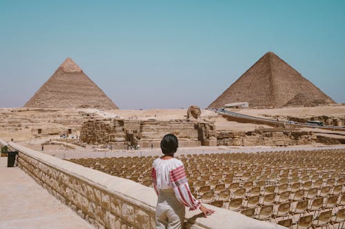 Woman Looking At Pyramids