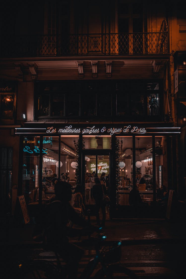 People Inside A Restaurant At Night