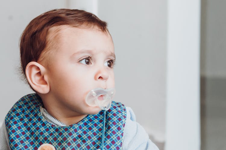 Baby With Pacifier On Mouth