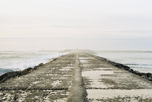 Tranquil view of a pier stretching into the ocean at Figueira da Foz, Portugal.