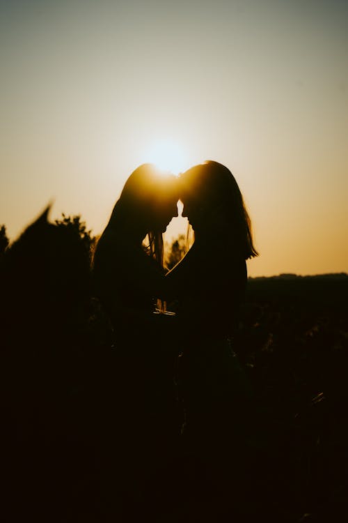 Silhouette of Women During Sunset