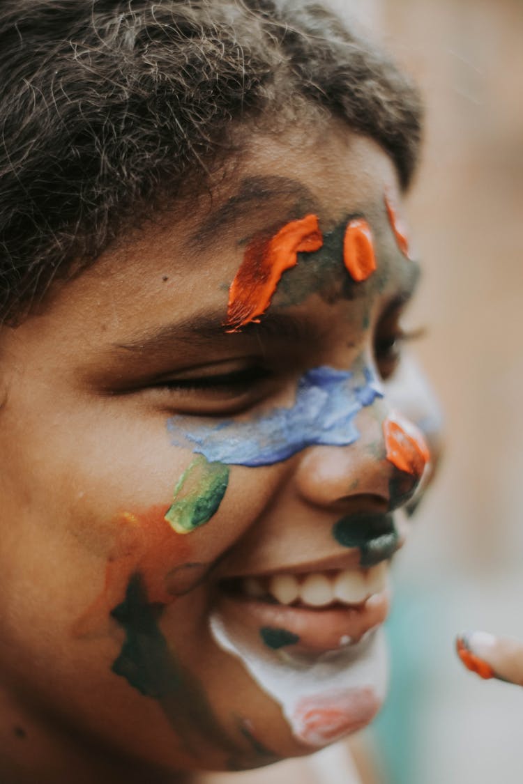 Photo Of A Boy With Paint On His Face 