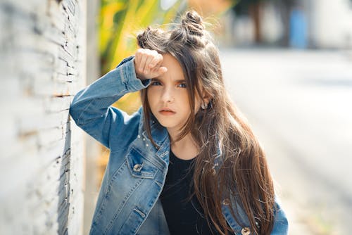 A Woman in Blue Denim Jacket