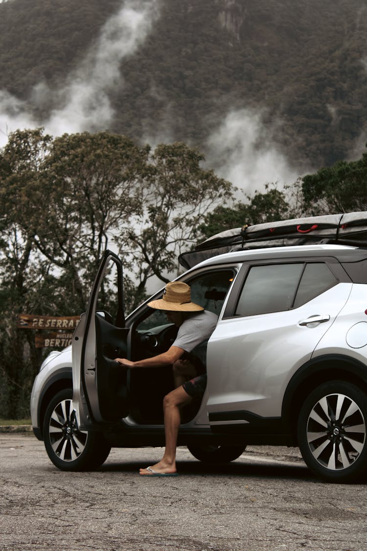 A Person Riding A Car