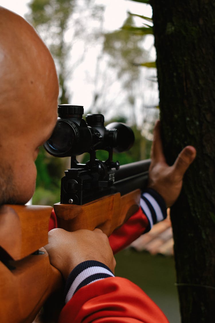 A Man Shooting A Gun