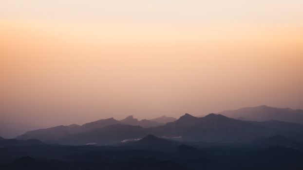 Stunning silhouette of Los Gigantes mountains at sunset in Tenerife, Canary Islands.