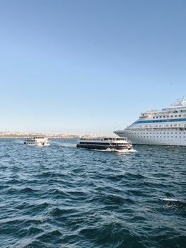 White and Blue Cruise Ship on Sea Under Blue Sky