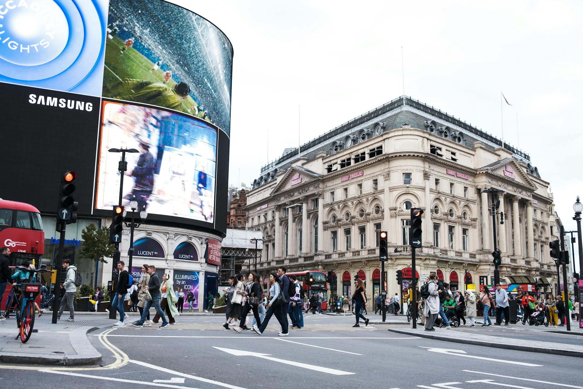 Vibrant city life at Piccadilly Circus, London, with iconic advertising screens and bustling crowds.