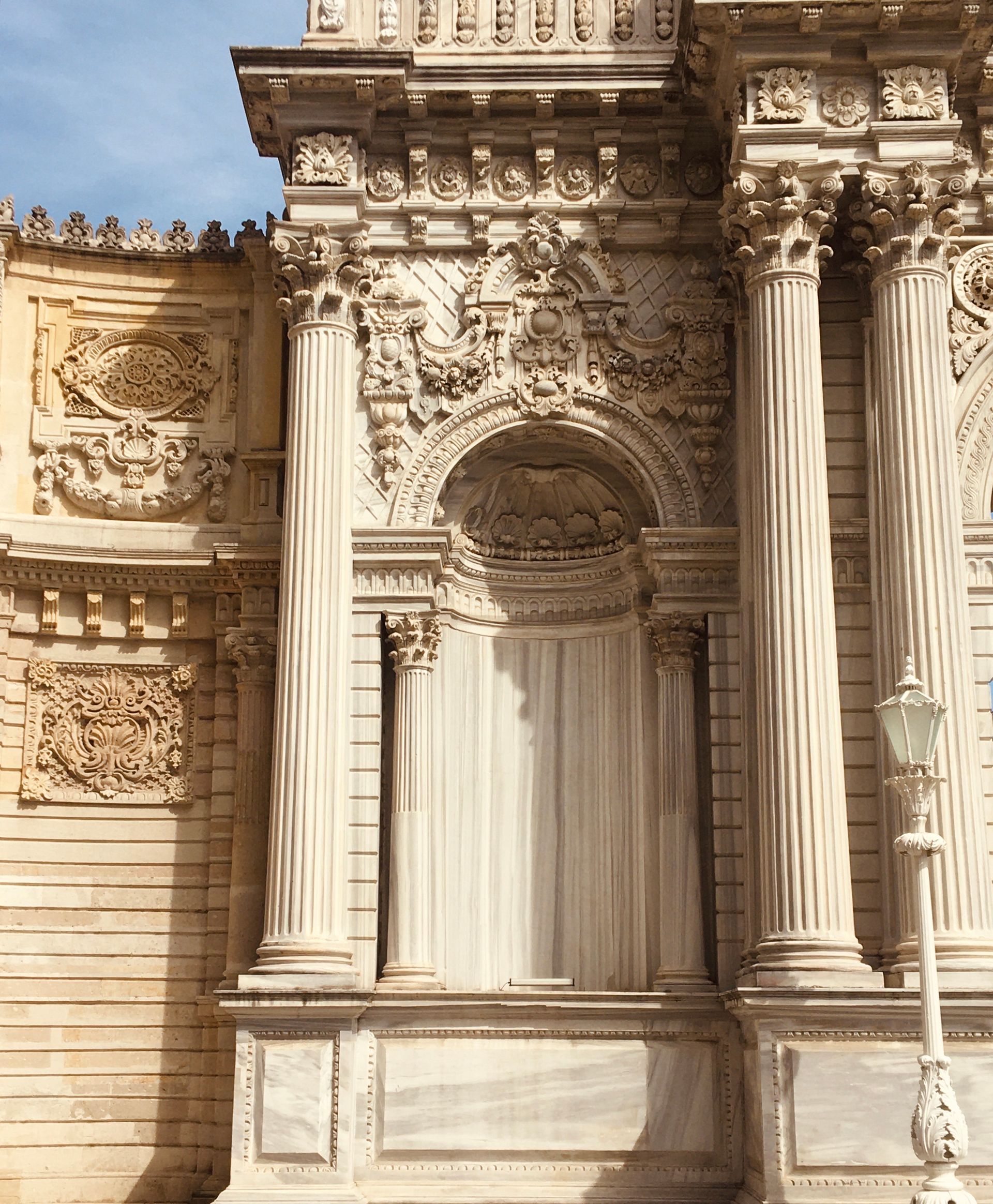 Classical carved stonework and grand columns on a period London facade