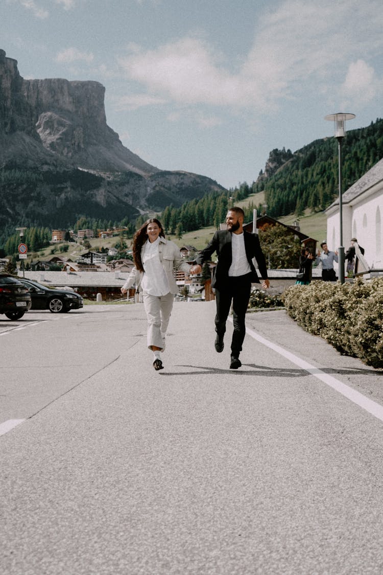 Man And Woman Running On The Street