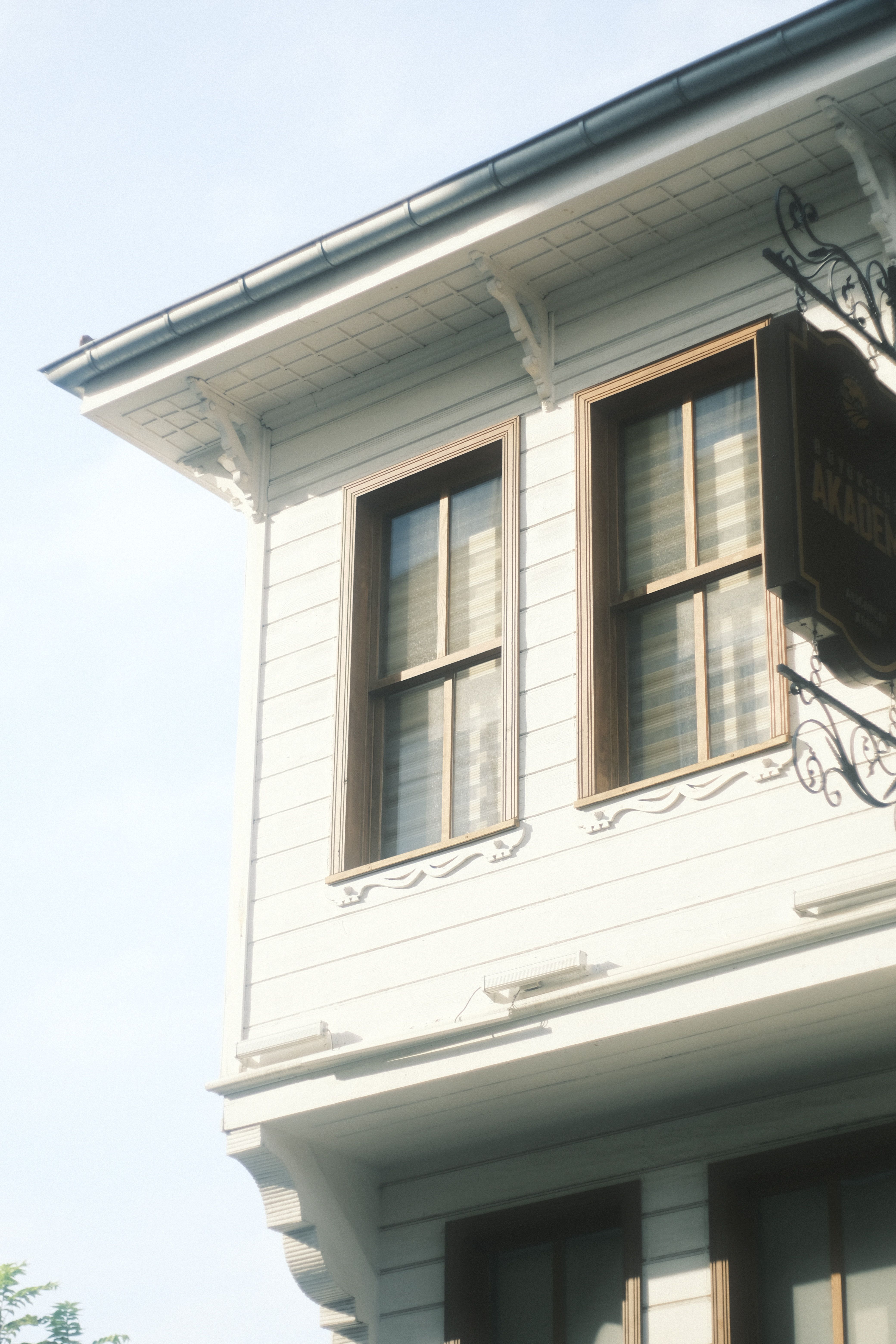 Low Angle Shot of Glass Windows of White Wooden House · Free Stock Photo