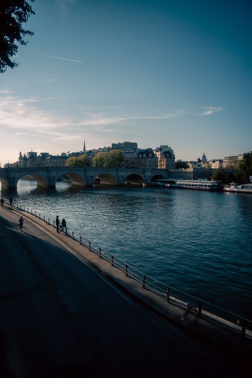 Free Beautiful view of a Paris bridge over the Seine River on a sunny day with clear blue skies. Stock Photo