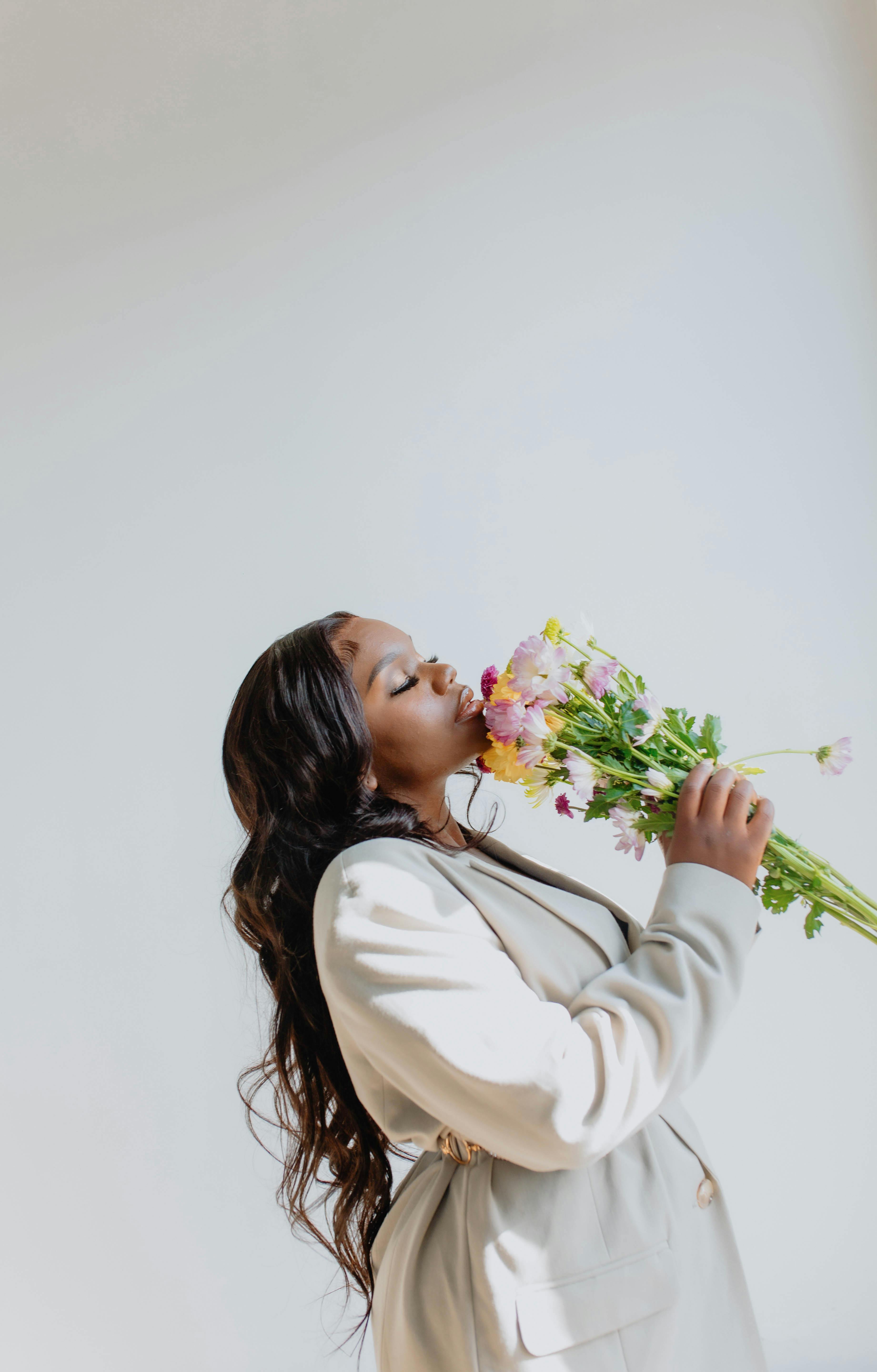 Women with Flowers Kissing · Free Stock Photo