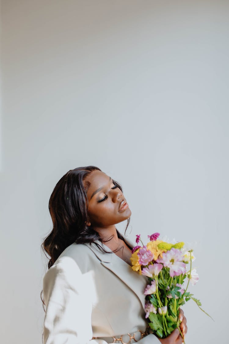 A Woman Holding Bouquet Of Flowers