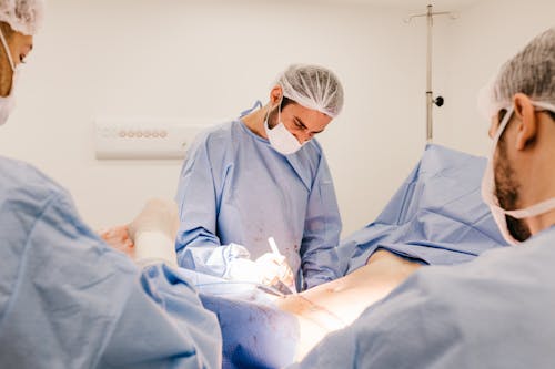 A Surgeon Operating on a Patient