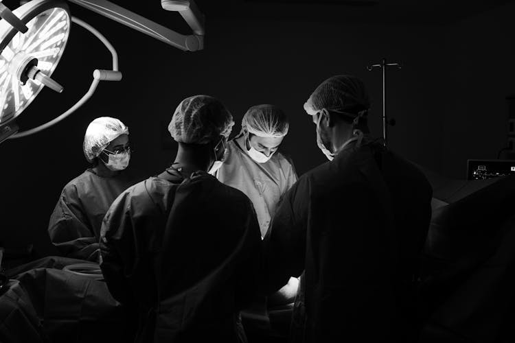 Doctors Performing A Surgery In The Operating Room 