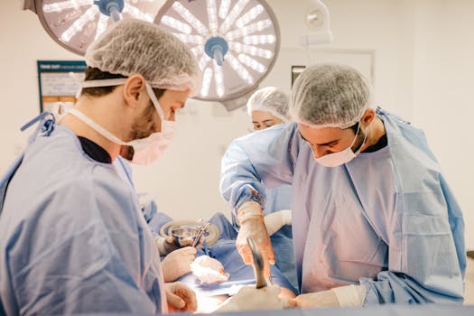 Team of surgeons working diligently in a well-lit operating room setting.