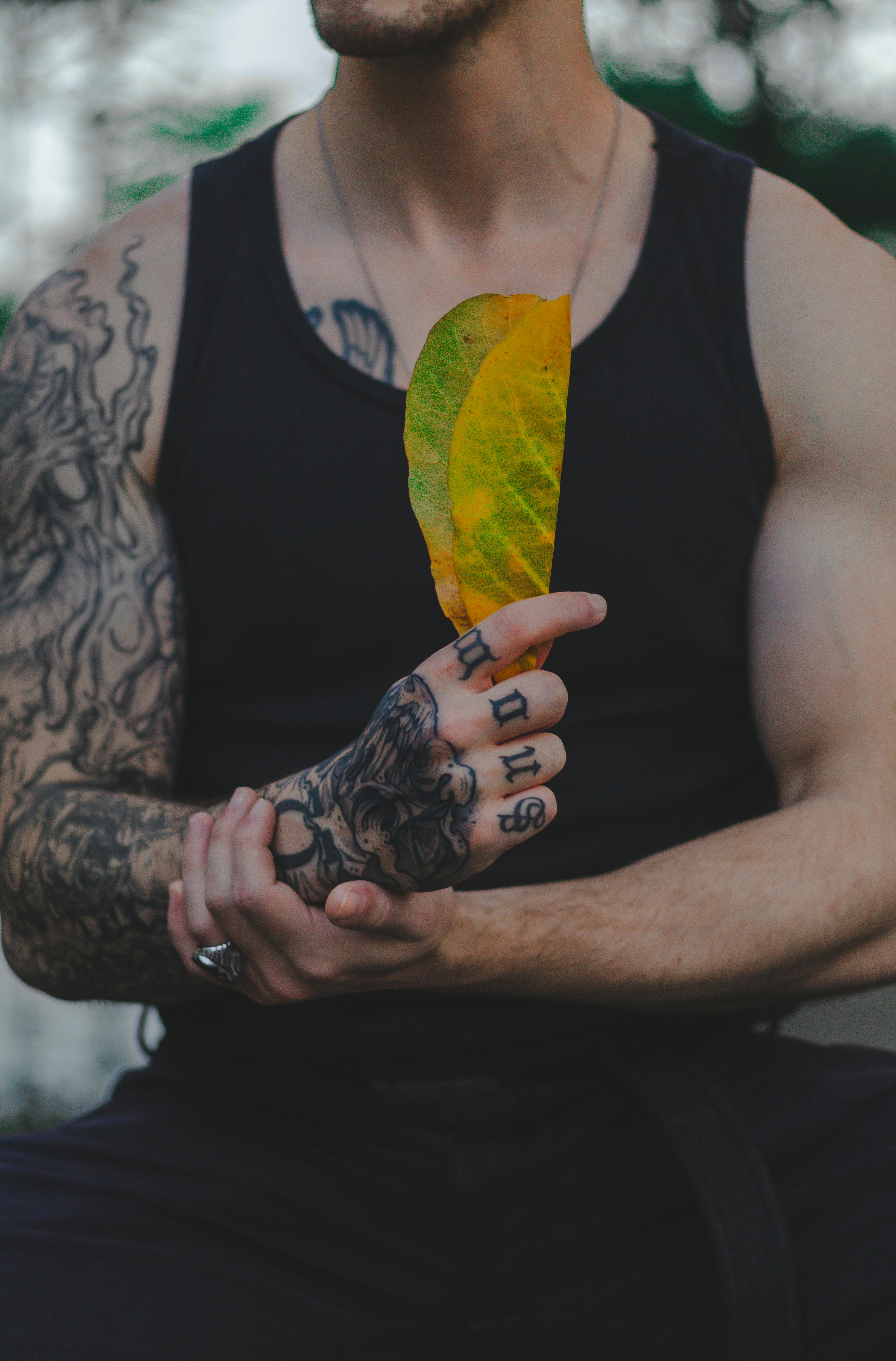Colored Leaf Tattoos On Man Right Sleeve