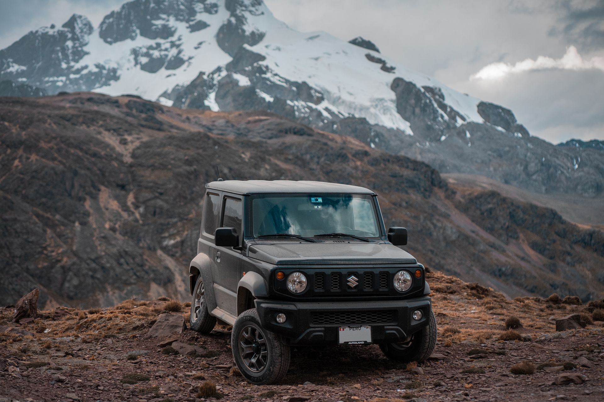 A Suzuki Jimny Parked on the Mountain