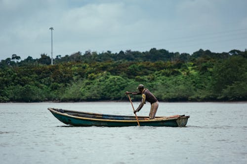Free A Person Riding a Boat  Stock Photo