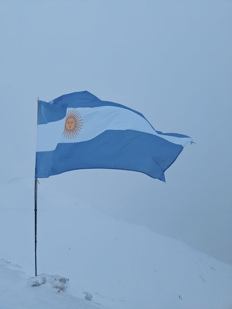 Argentina Flag On Snow Covered Mountain