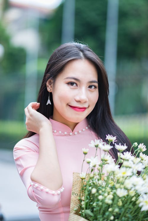 Beautiful Brunette Woman Holding a Bouquet 