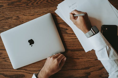 A Person Writing on the Paper