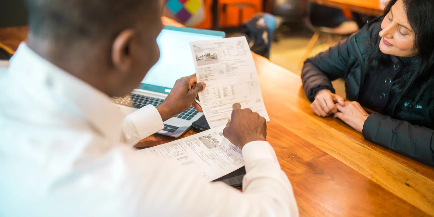 Engineer reviewing a service report with a client