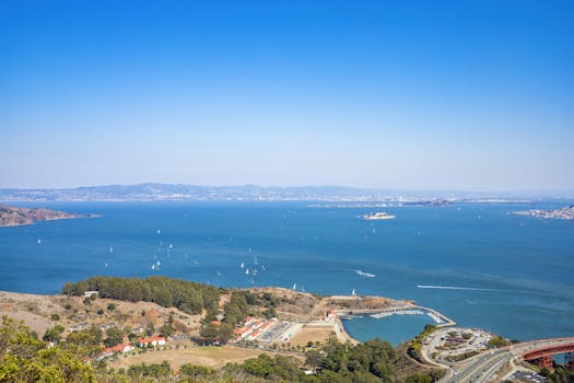 A breathtaking aerial view of the San Francisco Bay with sailboats and clear blue skies.