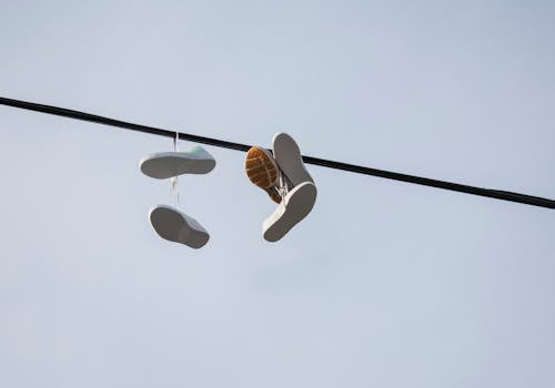 Shoes Hanged on Black Pole