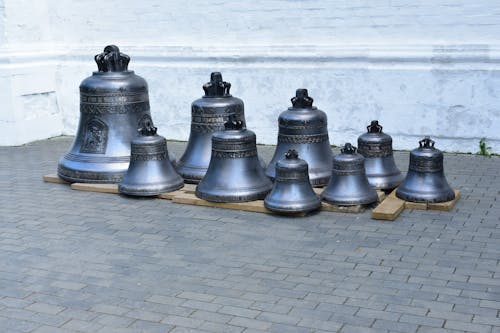 Brass Bells on Pavement