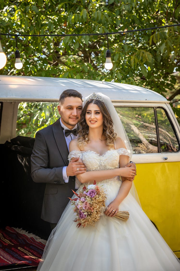 Married Couple Standing Near A Van