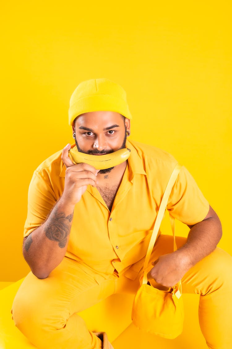 Bearded Man Holding A Banana