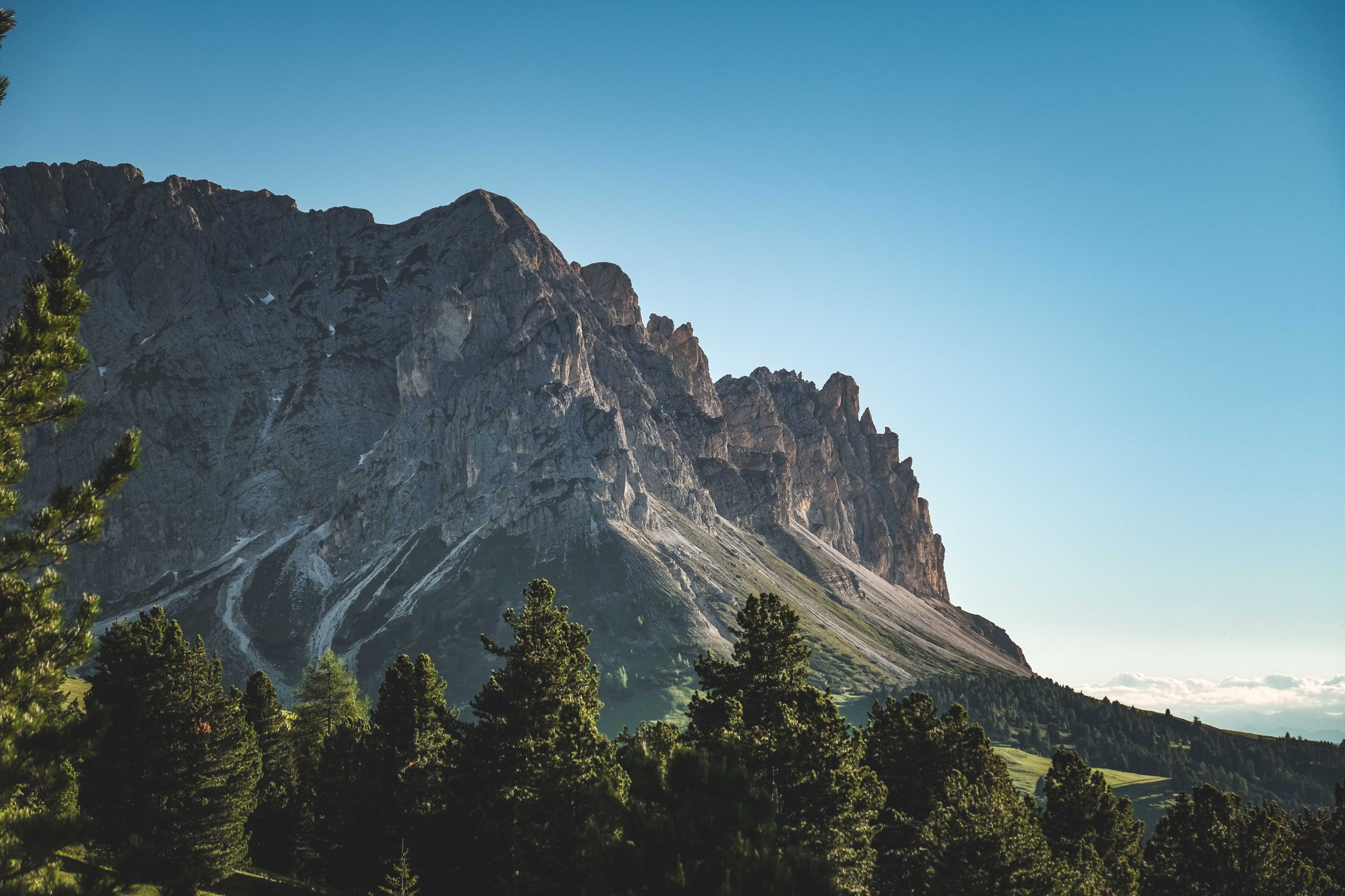 Green Trees Near Mountain Under Blue Sky · Free Stock Photo
