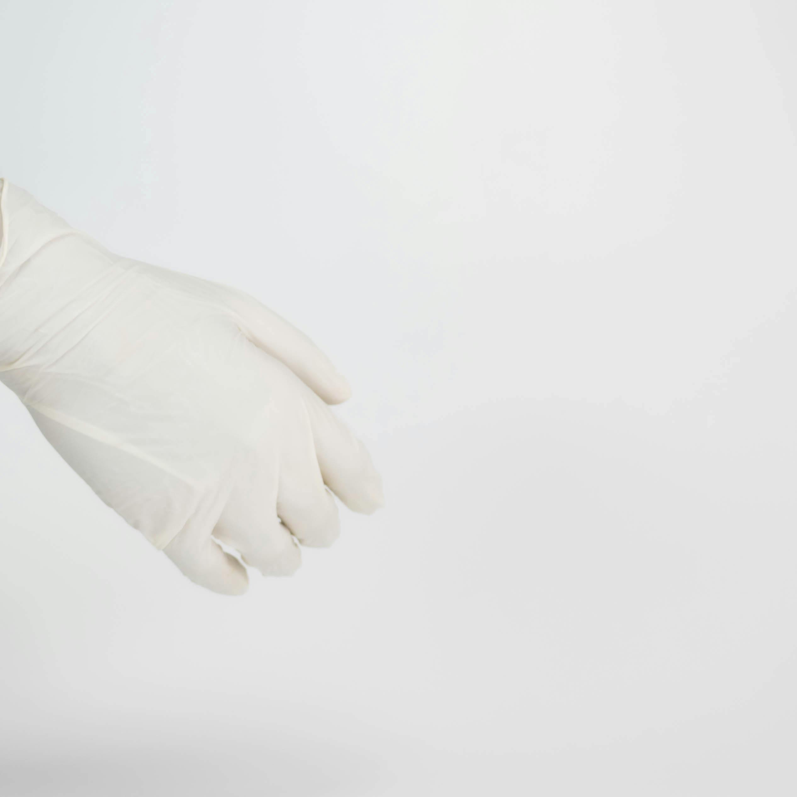 Wearing white store gloves