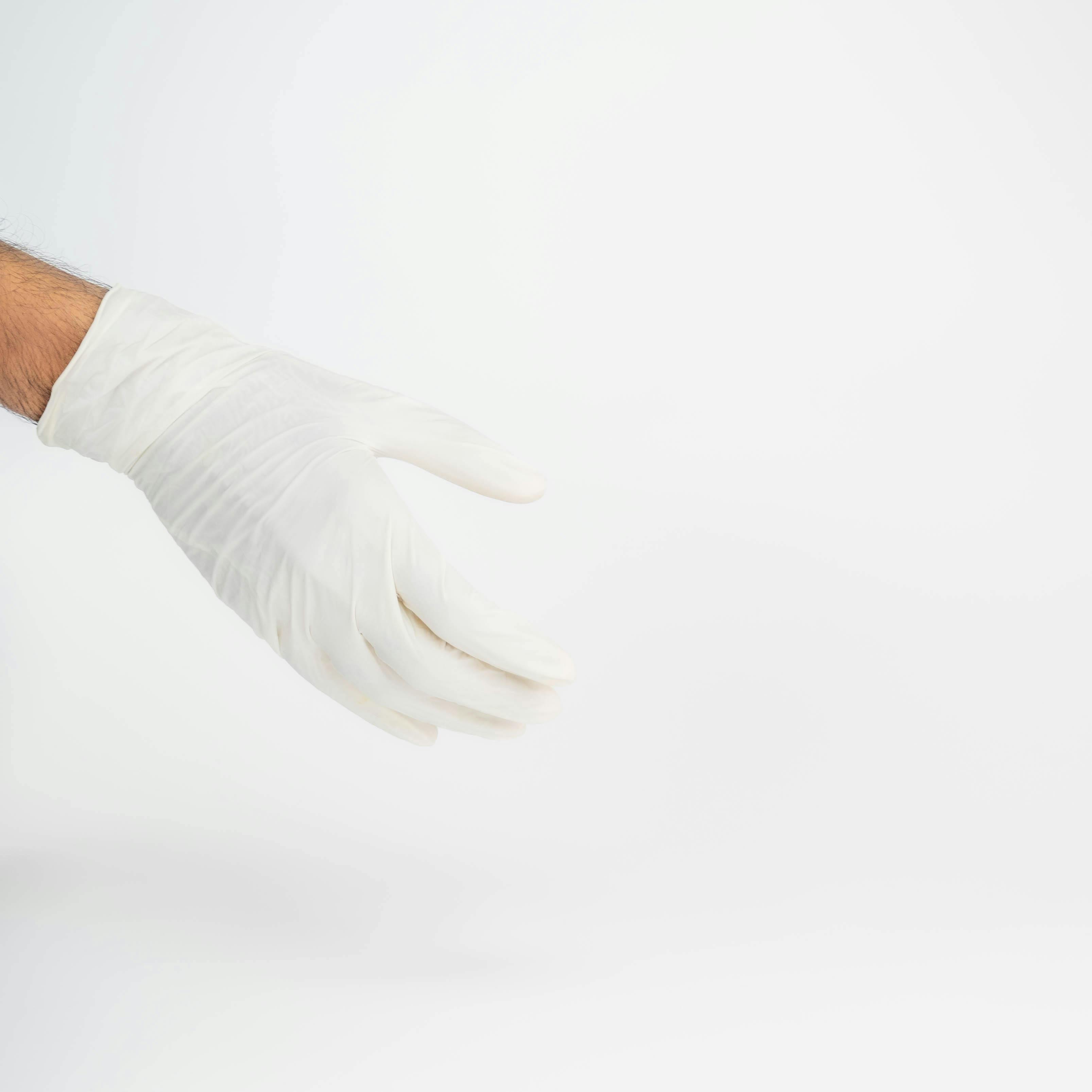 hand with white rubber glove