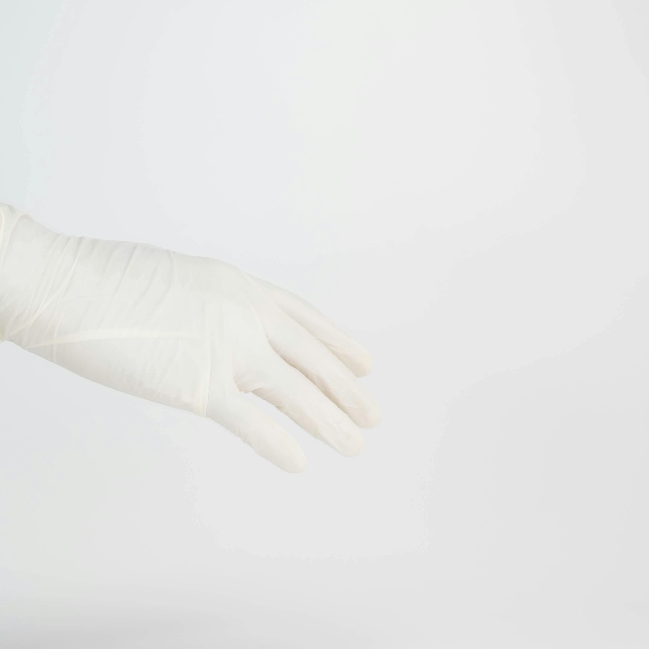 Person Wearing a Latex Glove · Free Stock Photo