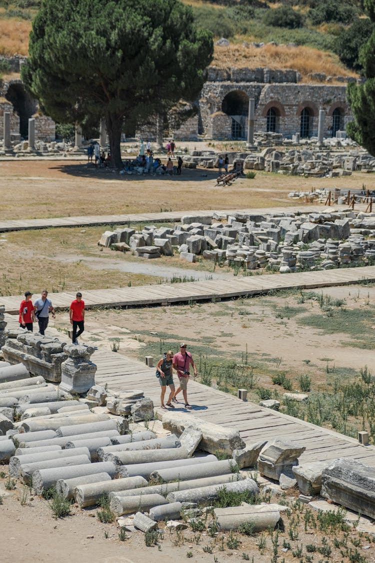 People Walking In Ancient City Ruins