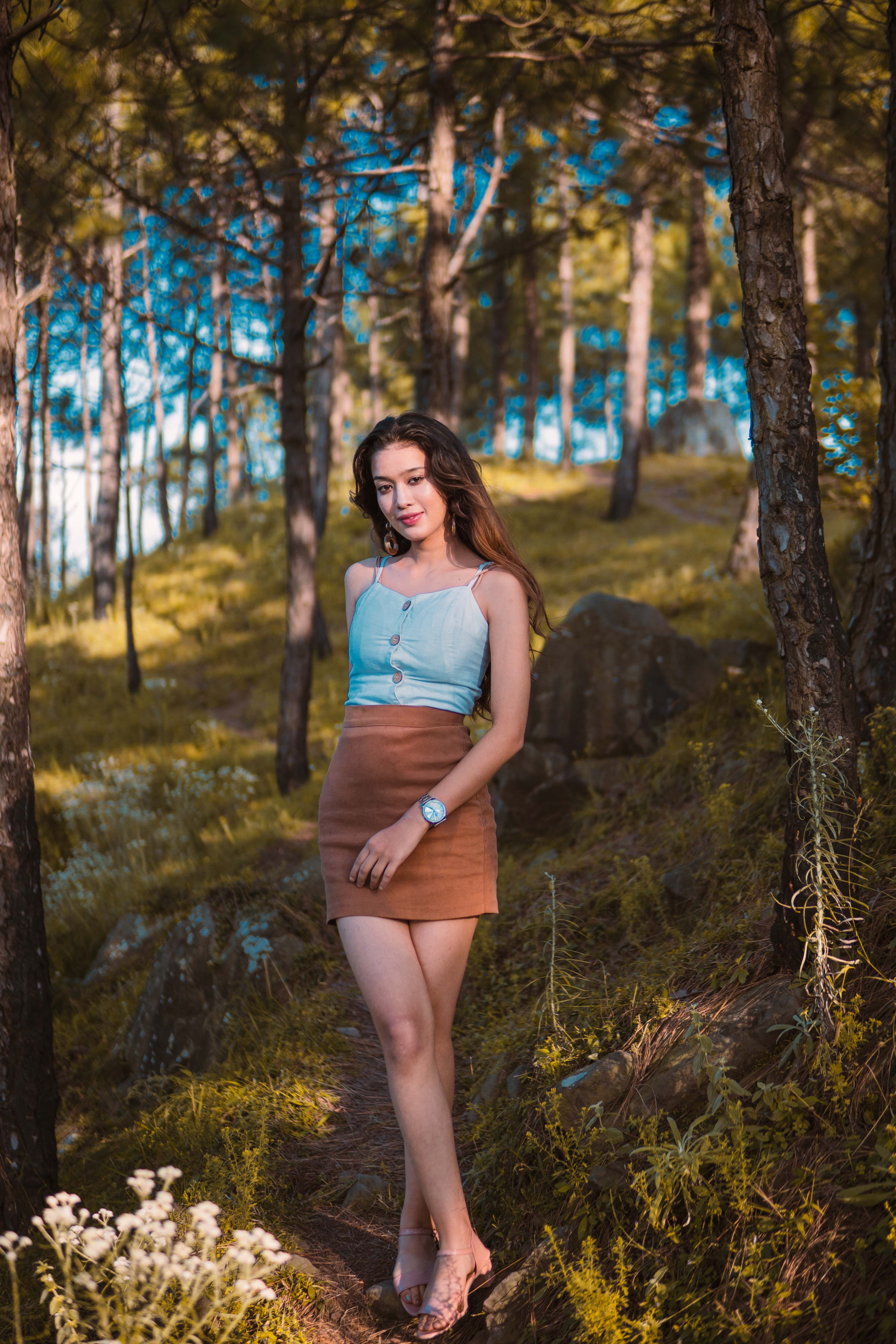 A Woman in Brown Dress Standing Beside the Tree · Free Stock Photo
