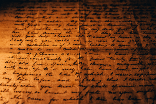 Close-up of Handwriting on an Old Vintage Paper Scroll