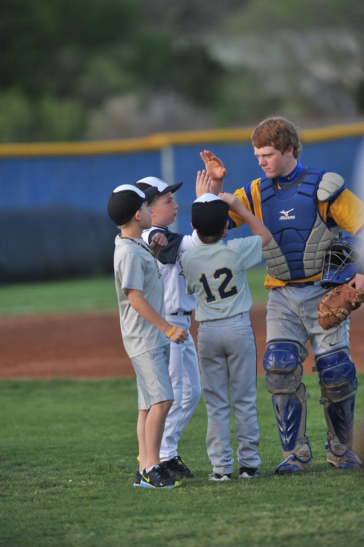 Young Rugby Players Sharing High Fives