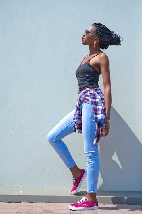 Woman in Sleeveless Top and Jeans Free Stock Photo