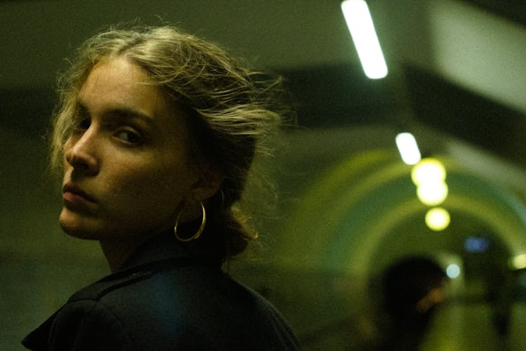 A Woman Wearing Hoop Earrings Looking Back