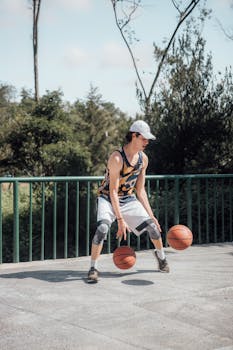 A young adult skillfully dribbling basketballs outdoors in Ciudad de México.