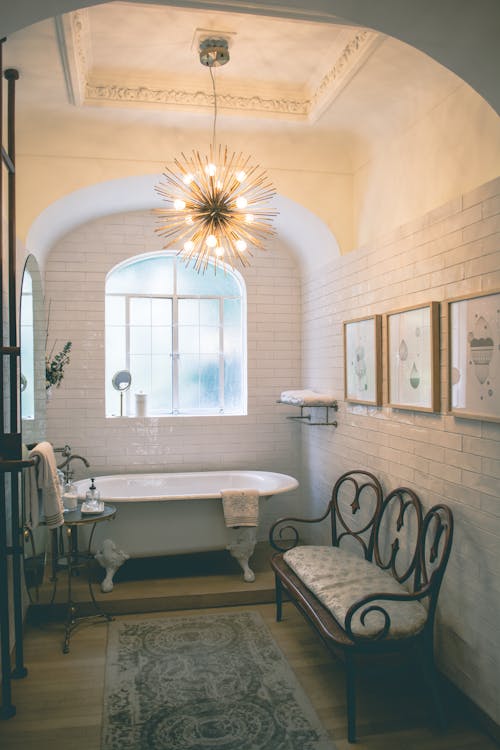 A chandeleir in the bathroom can transfrom it into a beautiful space. Photo by Luis Ruiz from Pexels