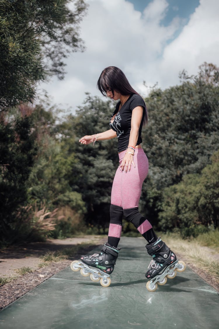 Girl Wearing Rollers And Knee Pads 